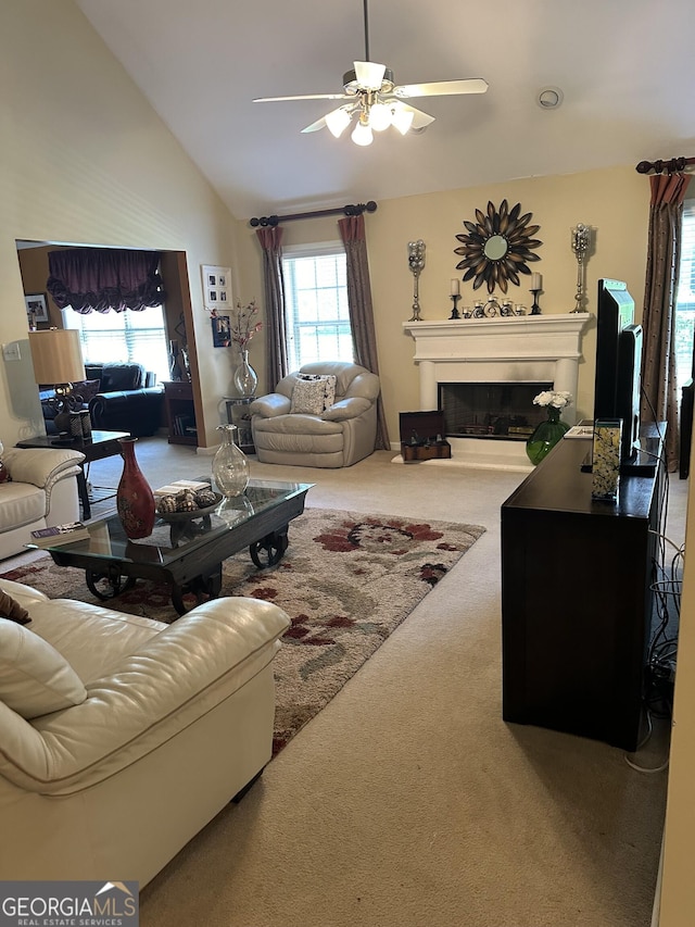 7946 Gossamer Dr, Fairburn, GA 30213 - living area with carpet, ceiling fan, lofted ceiling, and a fireplace