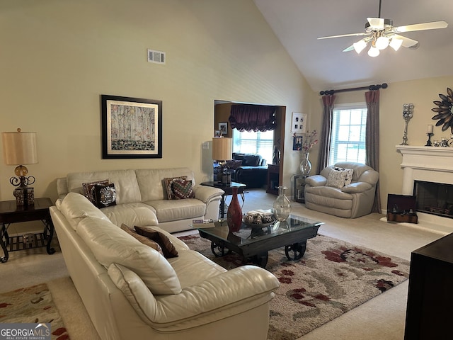 7946 Gossamer Dr, Fairburn, GA 30213 - living area featuring carpet floors, high vaulted ceiling, ceiling fan, and a fireplace