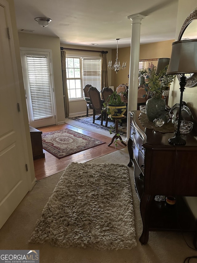 7946 Gossamer Dr, Fairburn, GA 30213 - foyer entrance featuring baseboards and ornate columns