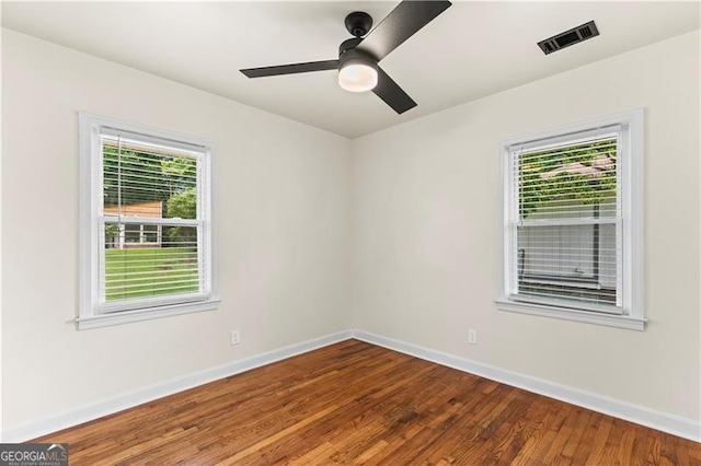 821 Springvalley Dr, Forest Park, GA 30297 - spare room with plenty of natural light, wood finished floors, and a ceiling fan