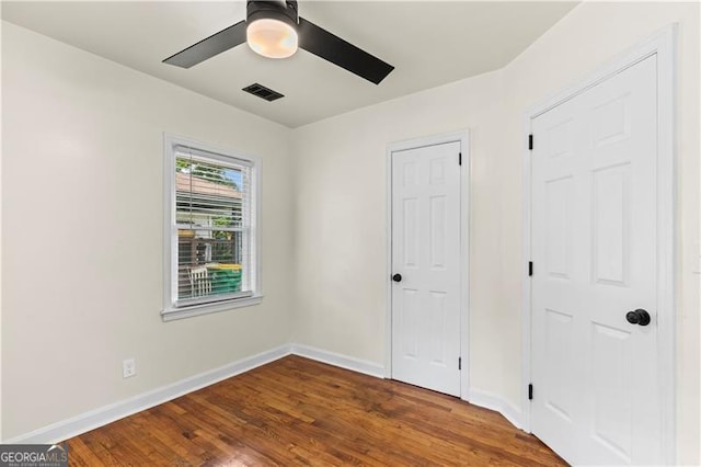 821 Springvalley Dr, Forest Park, GA 30297 - unfurnished bedroom featuring wood finished floors and a ceiling fan
