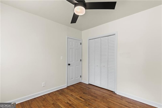 821 Springvalley Dr, Forest Park, GA 30297 - unfurnished bedroom with wood finished floors, a closet, and a ceiling fan