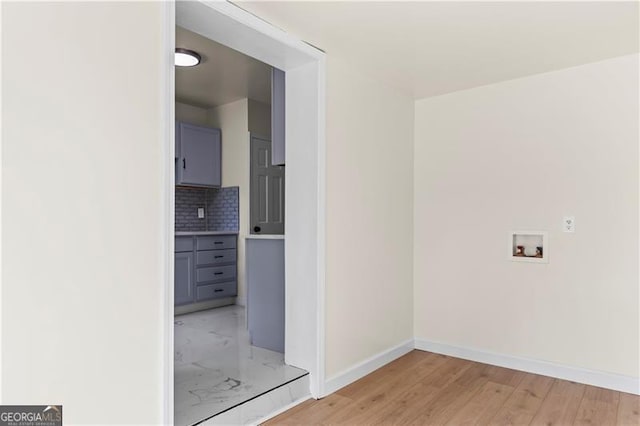 821 Springvalley Dr, Forest Park, GA 30297 - laundry room with hookup for a washing machine and light wood finished floors