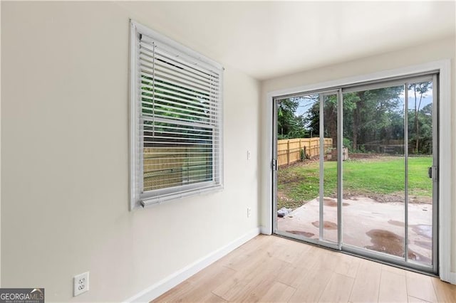 821 Springvalley Dr, Forest Park, GA 30297 - doorway featuring baseboards and wood finished floors