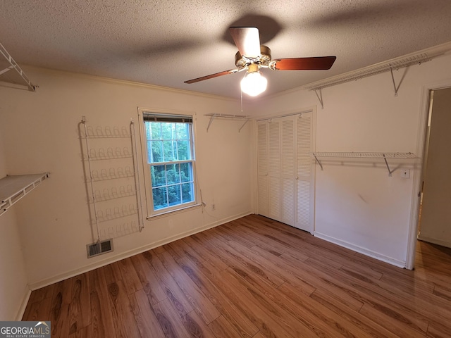 3054 Whisper Knob Rd, Marietta, GA 30062 - walk in closet with ceiling fan and wood finished floors