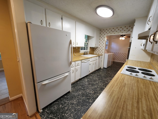 3054 Whisper Knob Rd, Marietta, GA 30062 - kitchen with white appliances, washing machine and dryer, white cabinetry, ceiling fan, and a textured ceiling