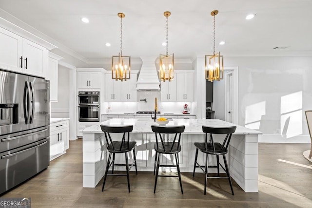 2381 Jones Phillips Rd, Dacula, GA 30019 - kitchen featuring stainless steel fridge, a chandelier, ornamental molding, custom exhaust hood, and a spacious island