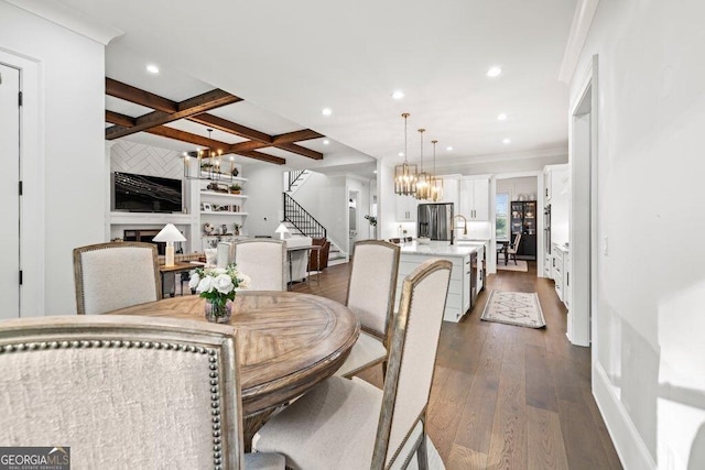 2381 Jones Phillips Rd, Dacula, GA 30019 - dining space featuring stairs, a chandelier, dark wood-style flooring, recessed lighting, and beam ceiling