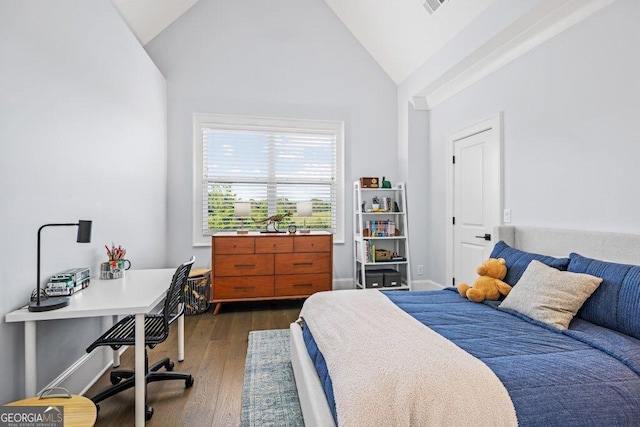 2381 Jones Phillips Rd, Dacula, GA 30019 - bedroom with dark wood-style flooring, vaulted ceiling, and a desk