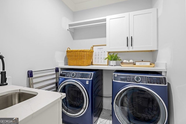 2381 Jones Phillips Rd, Dacula, GA 30019 - laundry area with washing machine and clothes dryer and cabinet space
