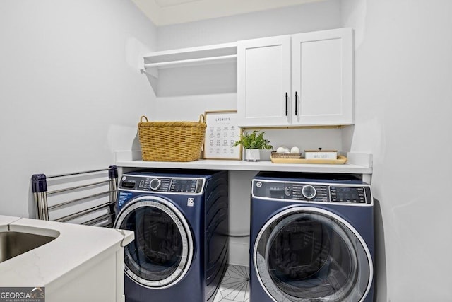 2381 Jones Phillips Rd, Dacula, GA 30019 - laundry area featuring cabinet space and washer and dryer