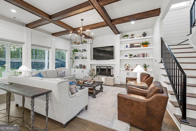 2381 Jones Phillips Rd, Dacula, GA 30019 - living room featuring stairway, healthy amount of natural light, beam ceiling, a chandelier, and dark wood-type flooring