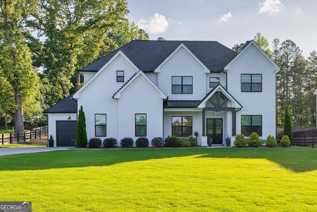 2381 Jones Phillips Rd, Dacula, GA 30019 - modern farmhouse featuring asphalt driveway, an attached garage, and a standing seam roof
