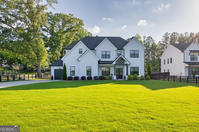 2381 Jones Phillips Rd, Dacula, GA 30019 - modern farmhouse style home with a standing seam roof, an attached garage, a metal roof, and driveway