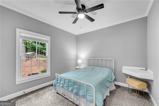 5301 Regency Lake Ct, Sugar Hill, GA 30518 - carpeted bedroom with crown molding and a ceiling fan