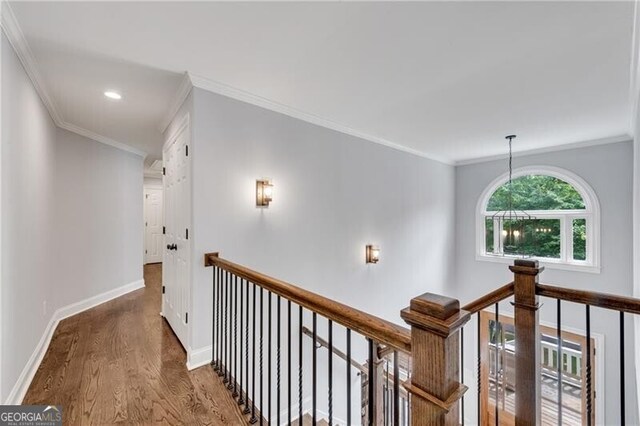 5301 Regency Lake Ct, Sugar Hill, GA 30518 - corridor featuring an upstairs landing, wood finished floors, recessed lighting, and crown molding