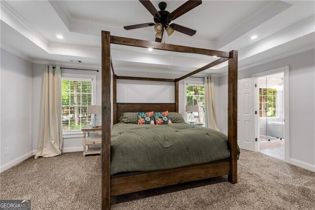 5301 Regency Lake Ct, Sugar Hill, GA 30518 - carpeted bedroom featuring crown molding, a tray ceiling, and recessed lighting