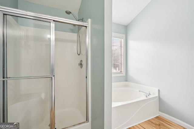 5686 Grindstone Dr, Buford, GA 30518 - full bath with a shower stall, wood finished floors, and a garden tub