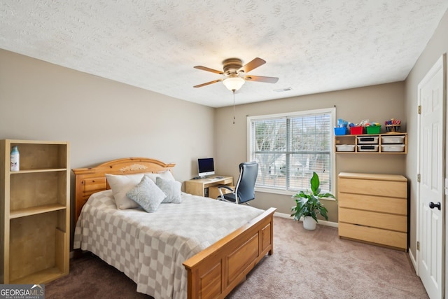 5686 Grindstone Dr, Buford, GA 30518 - bedroom featuring light carpet, an office area, a textured ceiling, and ceiling fan
