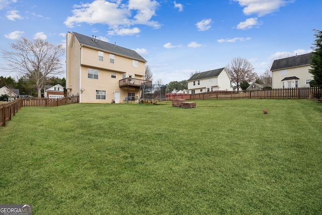 5686 Grindstone Dr, Buford, GA 30518 - fenced backyard featuring a trampoline and a deck