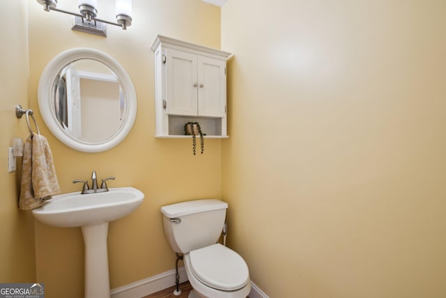 5686 Grindstone Dr, Buford, GA 30518 - bathroom featuring toilet and baseboards