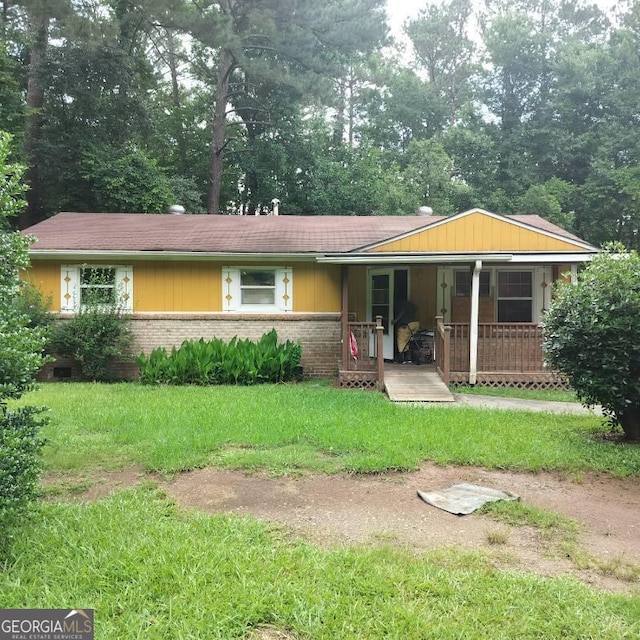 5420 Herndon Blvd, Morrow, GA 30260 - view of front facade with covered porch, brick siding, and a front lawn