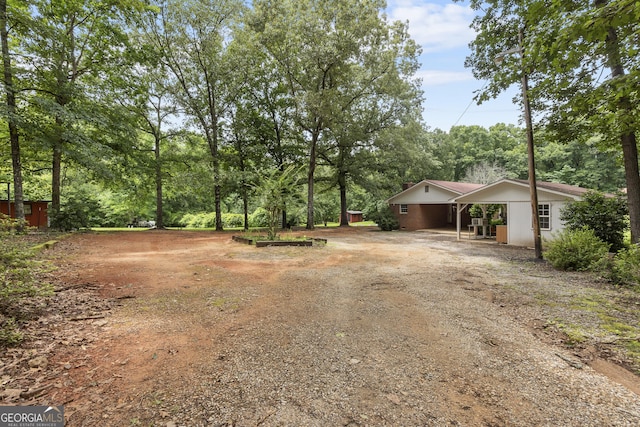 8692 Estes Rd, Macon, GA 31220 - view of front of home featuring dirt driveway and a carport