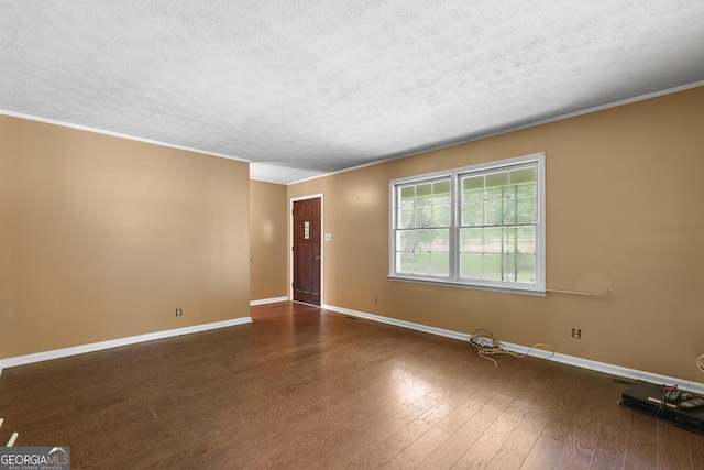 8692 Estes Rd, Macon, GA 31220 - unfurnished room featuring a textured ceiling, wood finished floors, and crown molding