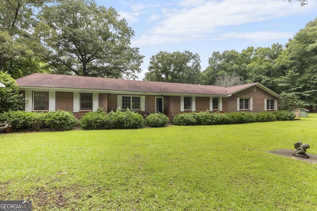 8692 Estes Rd, Macon, GA 31220 - ranch-style house featuring a front lawn and brick siding