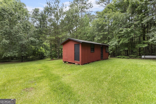 8692 Estes Rd, Macon, GA 31220 - view of grassy yard with a storage shed