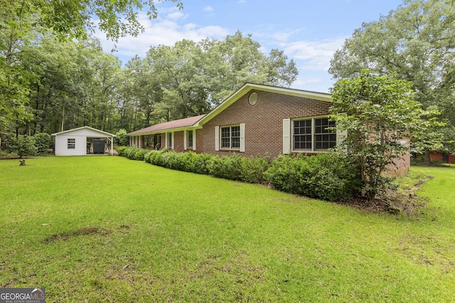 8692 Estes Rd, Macon, GA 31220 - view of front facade with brick siding and a front lawn