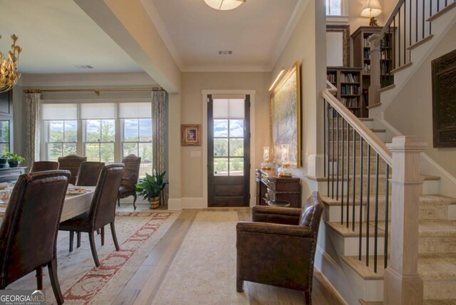 24 Lakewood Park N, Statham, GA 30666 - entryway with wood finished floors, stairway, and crown molding