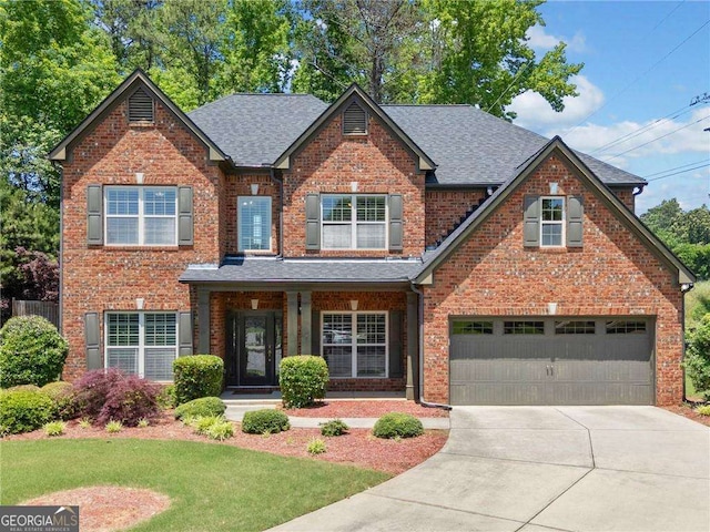 5285 Winflow Way, Suwanee, GA 30024 - view of front of property with brick siding, a shingled roof, an attached garage, driveway, and a front yard