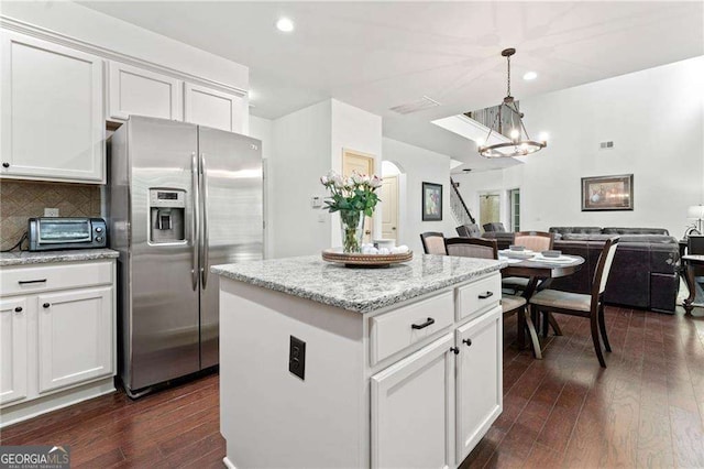 5285 Winflow Way, Suwanee, GA 30024 - kitchen with stainless steel refrigerator with ice dispenser, a chandelier, open floor plan, a kitchen island, and dark wood-type flooring