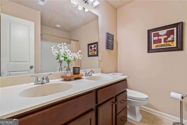 5285 Winflow Way, Suwanee, GA 30024 - bathroom with double vanity, tile patterned floors, and a shower with curtain