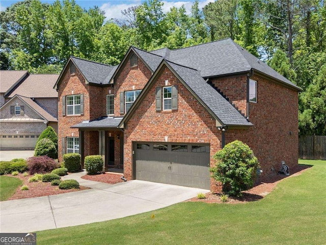 5285 Winflow Way, Suwanee, GA 30024 - view of front of house with a garage, concrete driveway, brick siding, and roof with shingles