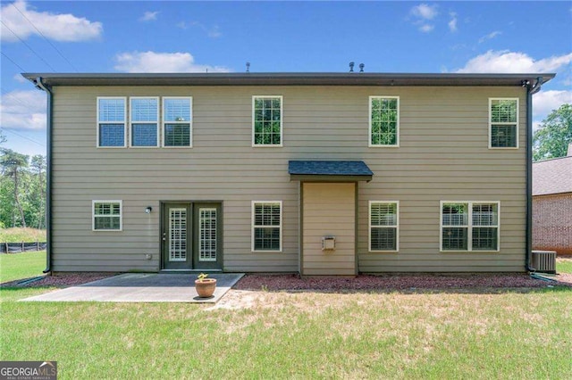 5285 Winflow Way, Suwanee, GA 30024 - back of property with a patio and a lawn