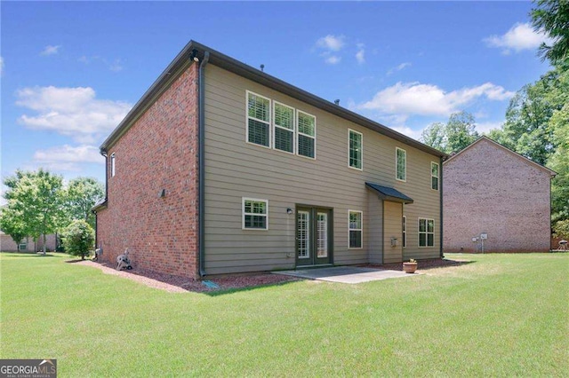 5285 Winflow Way, Suwanee, GA 30024 - back of property with a yard, a patio area, brick siding, and french doors