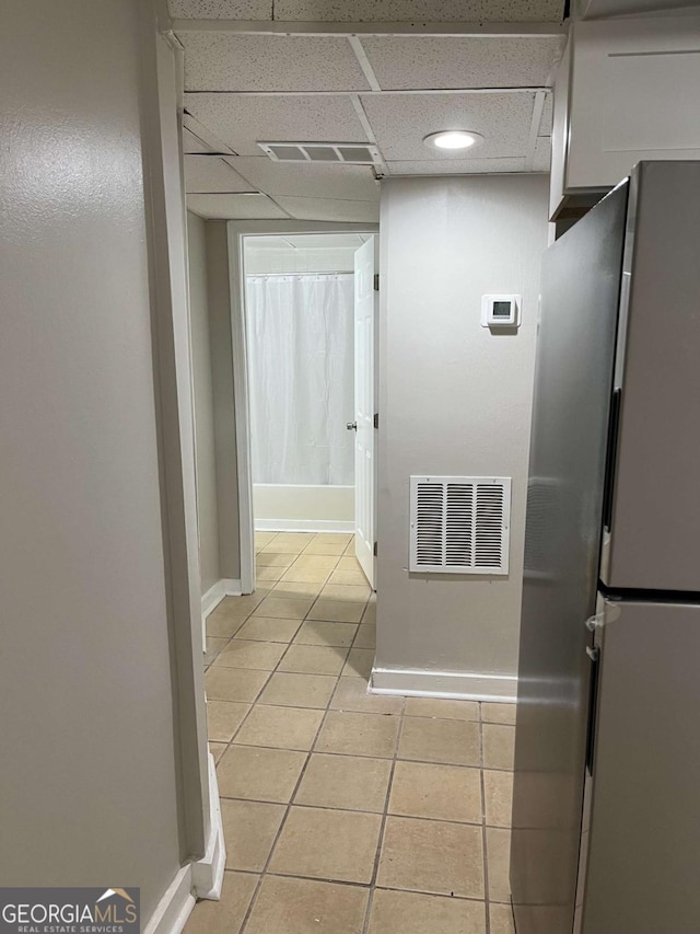 3351 Fox St, Duluth, GA 30096 - hallway with light tile patterned floors and a drop ceiling