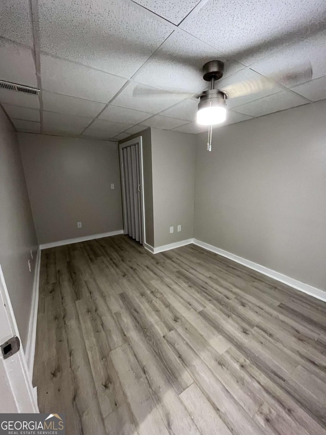 3351 Fox St, Duluth, GA 30096 - unfurnished room with a paneled ceiling, wood finished floors, and ceiling fan