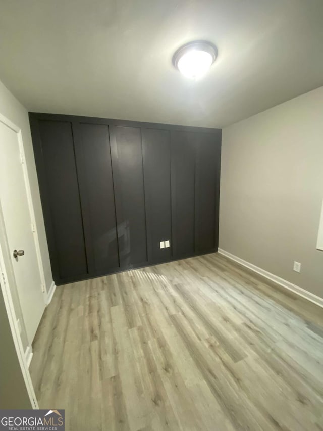 3351 Fox St, Duluth, GA 30096 - unfurnished bedroom featuring light wood-type flooring
