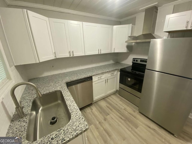 3351 Fox St, Duluth, GA 30096 - kitchen with appliances with stainless steel finishes, wall chimney exhaust hood, ornamental molding, and white cabinetry