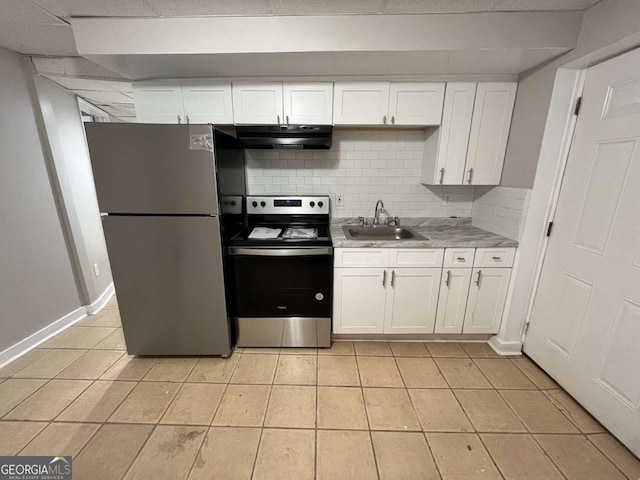 3341 Fox St, Duluth, GA 30096 - kitchen featuring appliances with stainless steel finishes, under cabinet range hood, white cabinetry, light tile patterned flooring, and light countertops