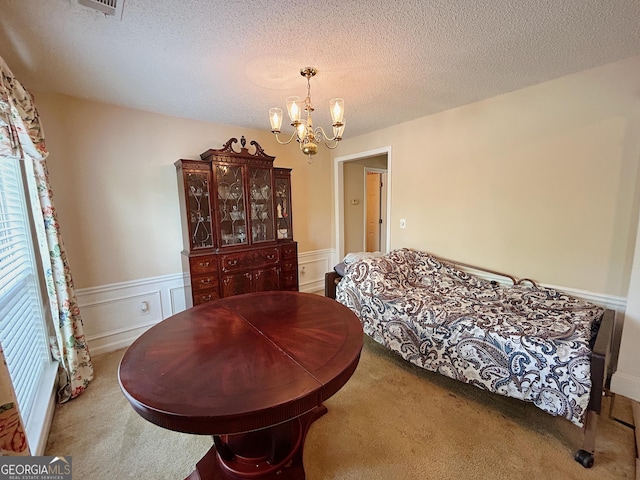 5190 Bankside Way, Peachtree Corners, GA 30092 - dining area featuring a chandelier, carpet, a textured ceiling, and a wainscoted wall