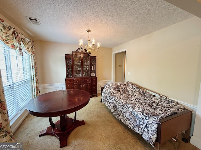 5190 Bankside Way, Peachtree Corners, GA 30092 - carpeted bedroom featuring multiple windows, a chandelier, a textured ceiling, and a wainscoted wall