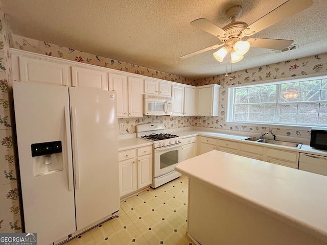 5190 Bankside Way, Peachtree Corners, GA 30092 - kitchen featuring white appliances, a ceiling fan, light countertops, a textured ceiling, and white cabinets