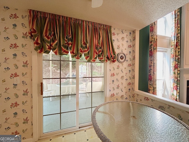 5190 Bankside Way, Peachtree Corners, GA 30092 - unfurnished dining area with wallpapered walls and a textured ceiling