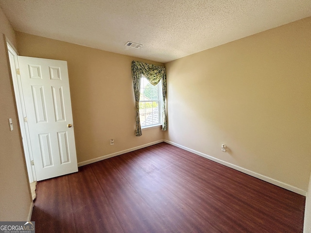 5190 Bankside Way, Peachtree Corners, GA 30092 - empty room with wood finished floors and a textured ceiling