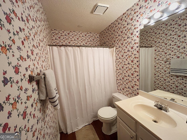 5190 Bankside Way, Peachtree Corners, GA 30092 - full bathroom featuring wallpapered walls, a textured ceiling, vanity, wood finished floors, and curtained shower