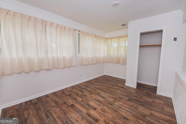 5763 Houston Rd, Macon, GA 31216 - unfurnished bedroom with wood finished floors and a closet